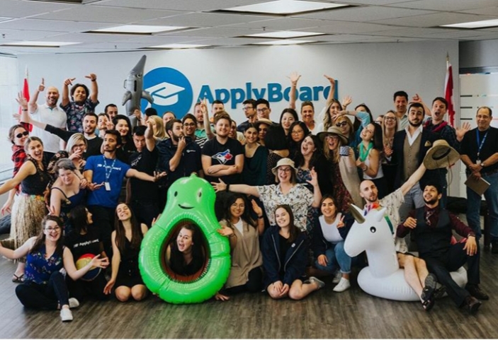 Staff posing in their themed summer outfits