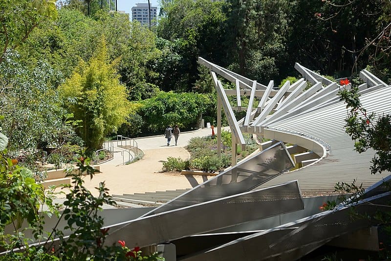 A modern, spiraling timber roof traces a garden path on UCLA's campus.