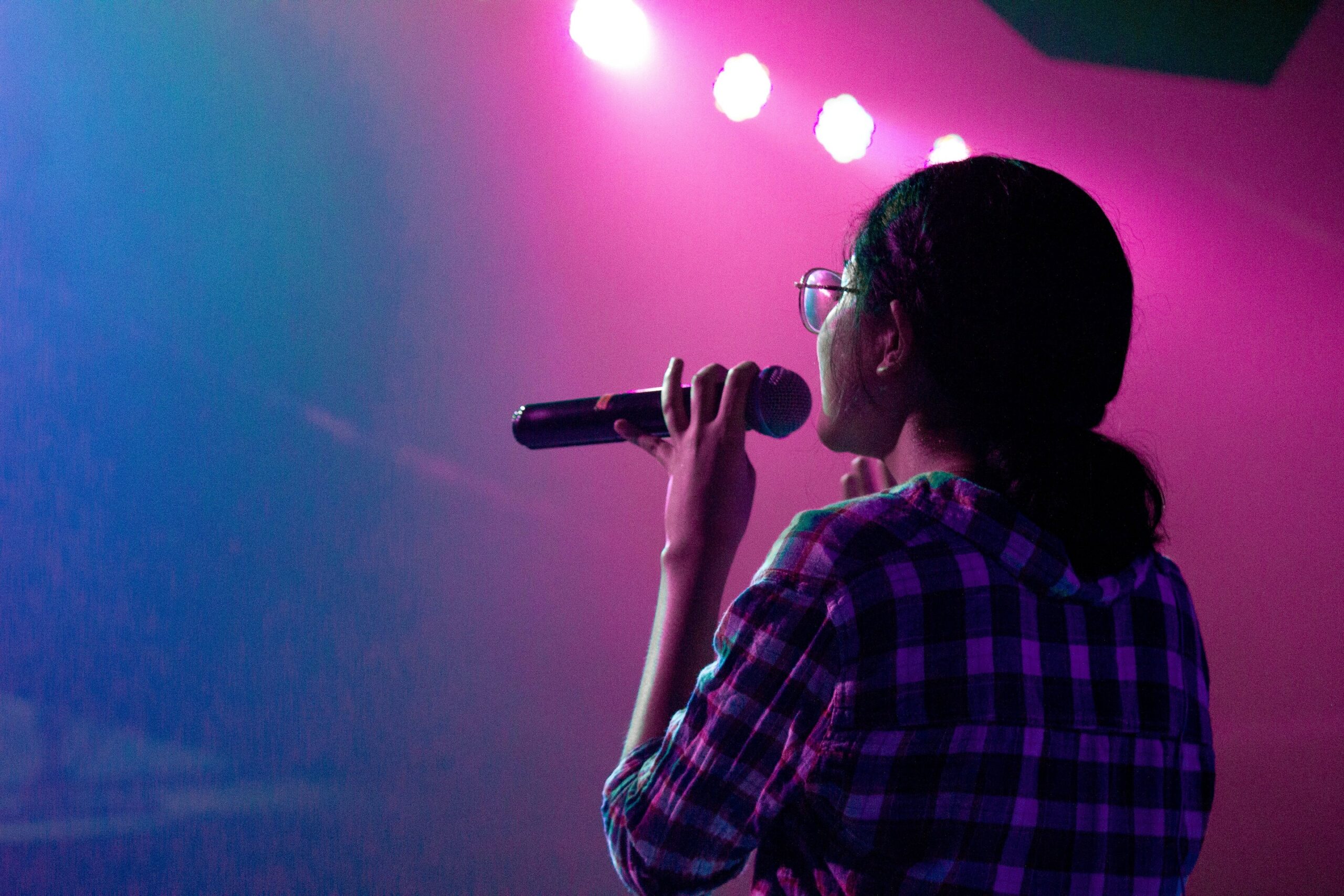 Woman speaking into microphone