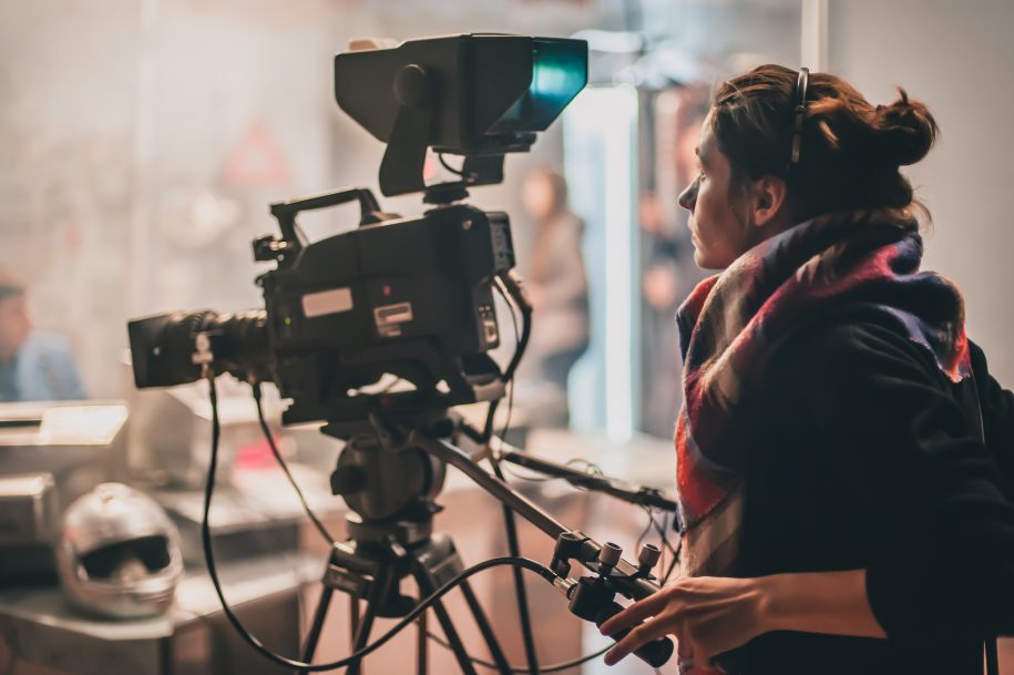 Woman using video camera