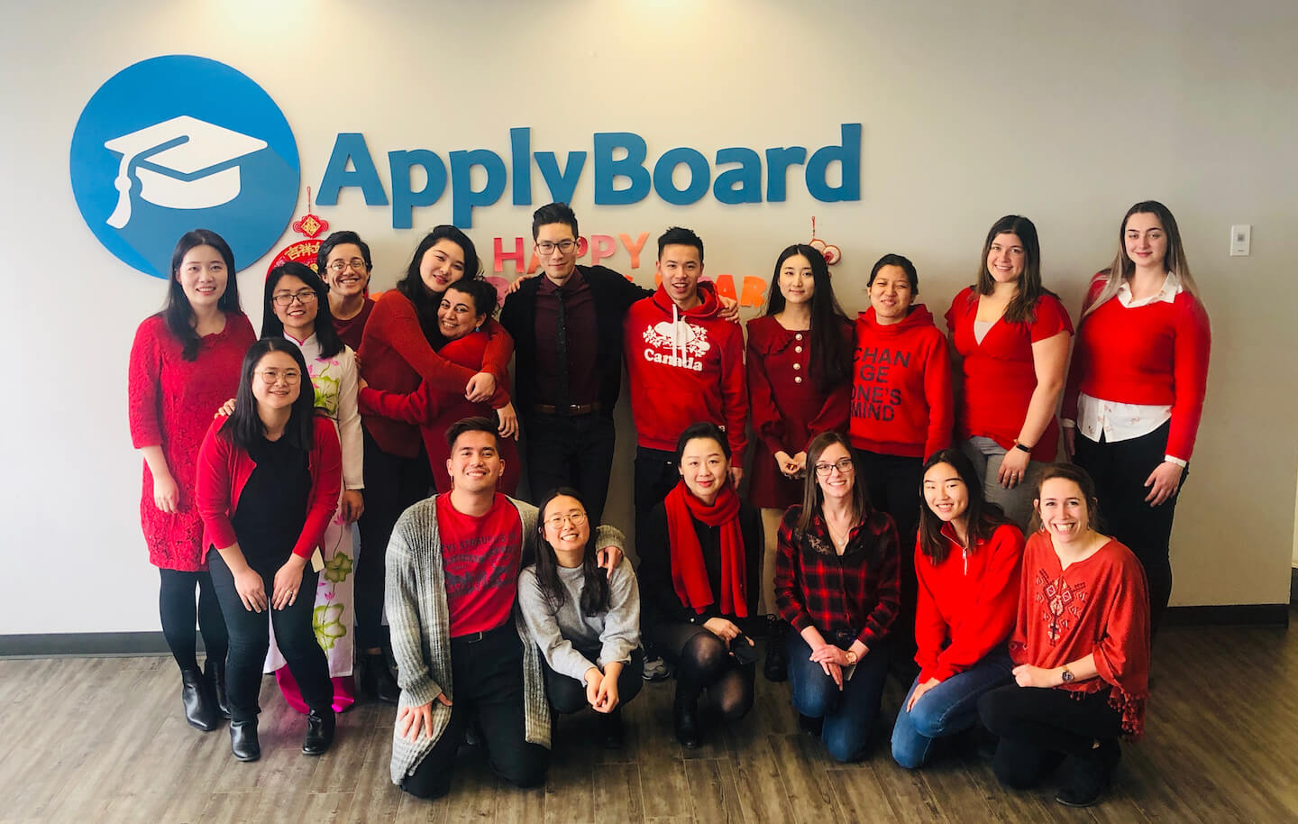 ApplyBoard staff wearing red at the office Lunar New Year celebration