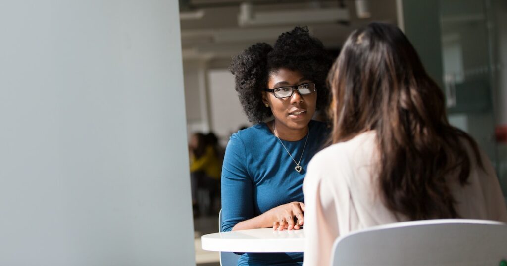 Two women speaking