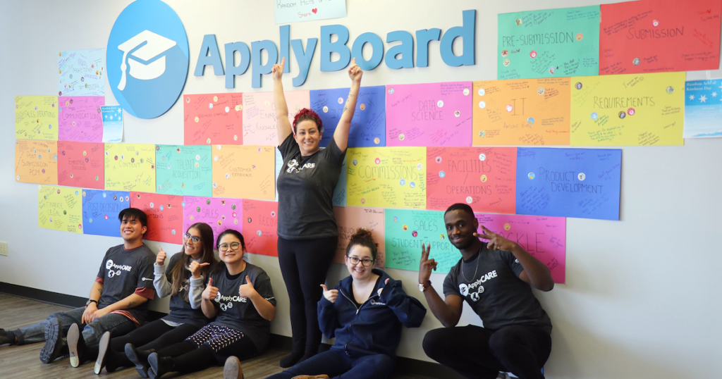 The ApplyCare Team with their Random Acts of Kindness wall