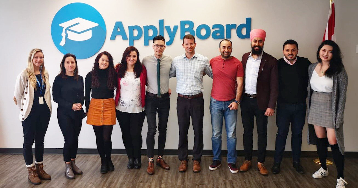 Kelvin with his team during a school visit at the ApplyBoard office