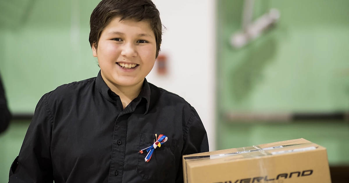 Boy holding a Friendship Box