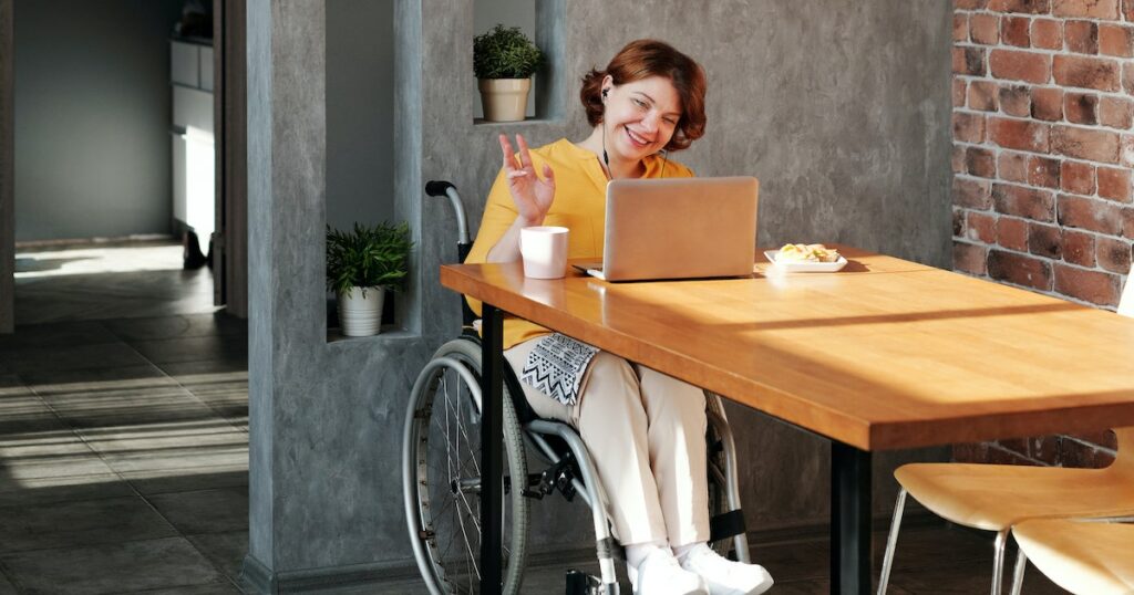 Woman smiling at laptop