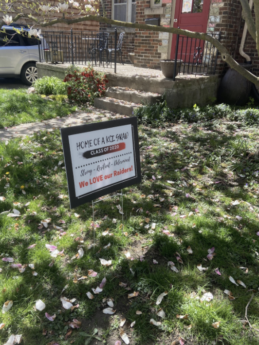 Sign in front yard congratulating graduate