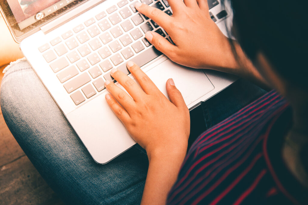 Person typing on laptop