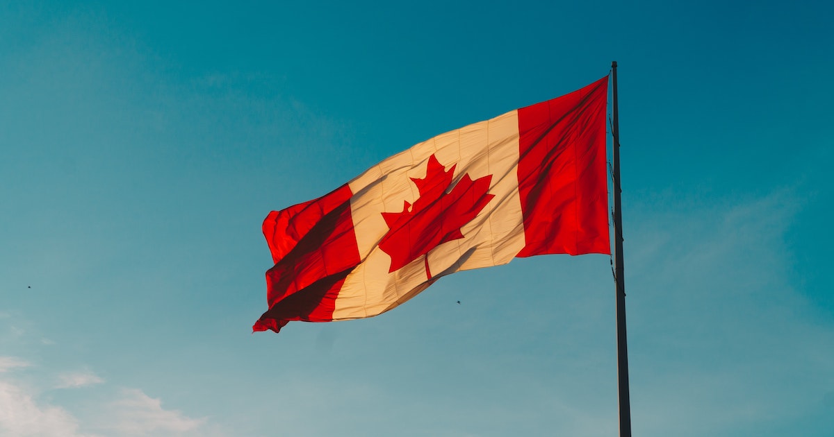 Canada flag against sky