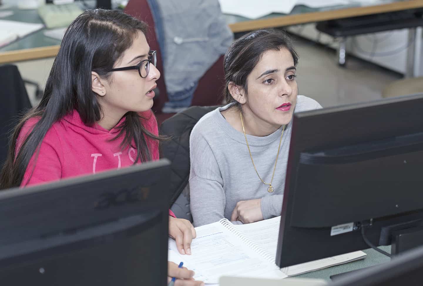 Two Great Plains College students at computer