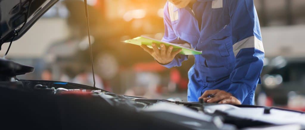 Photograph of Automotive Mechanical Diagnosis student working on vehicle