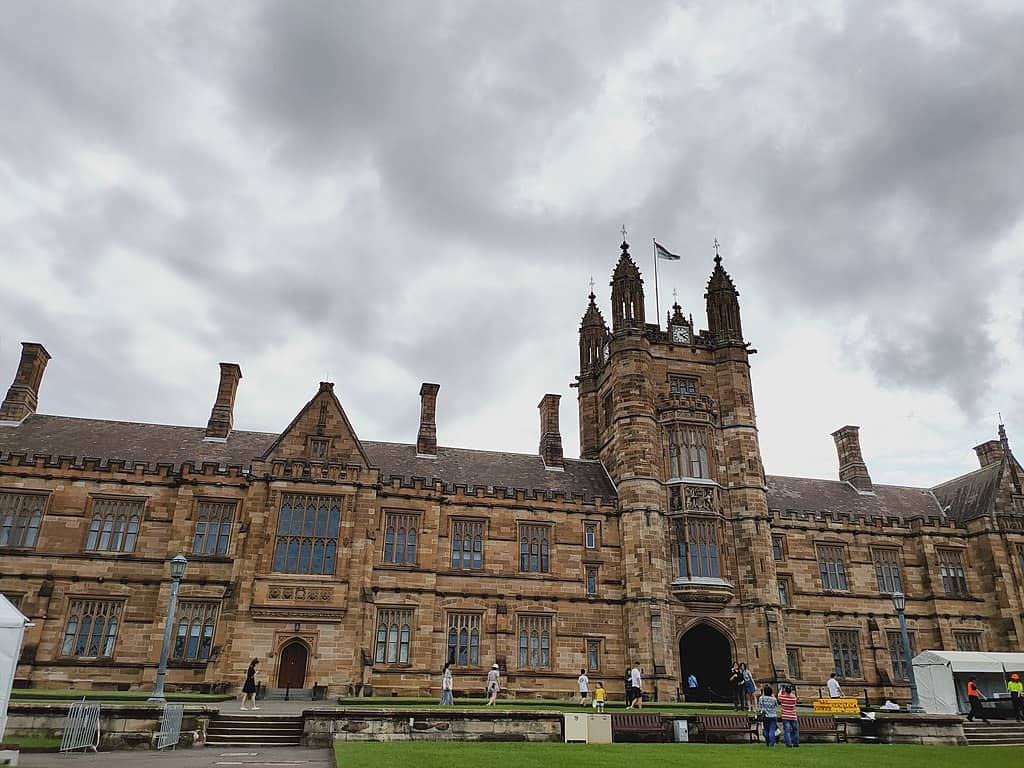 The University of Sydney's Main Building, an impressive two-storey sandstone building with a central tower.