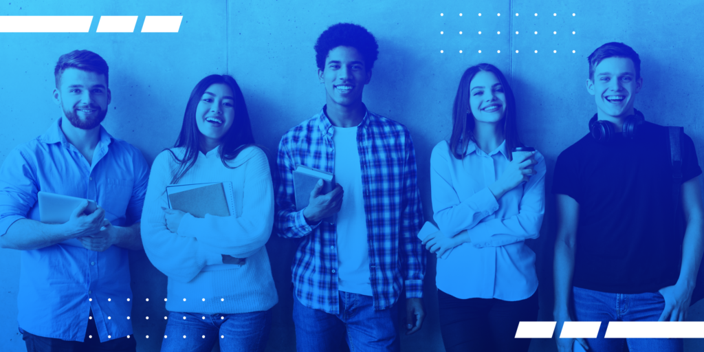 A photo of a group of students standing against a wall.