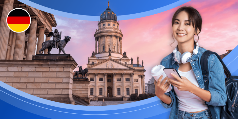A young woman wearing headphones and a backpack, and carrying a phone and a disposable coffee cup is framed by the German flag and two impressive stone buildings with ornate sculptures at twilight.