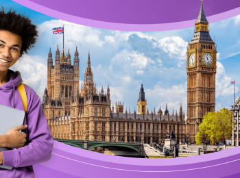 An international student stands in front of part of the London, UK skyline.